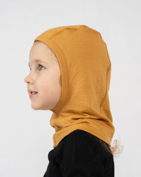Side view of kids yellow merino wool balaclava, lightweight thermal protection for children.
