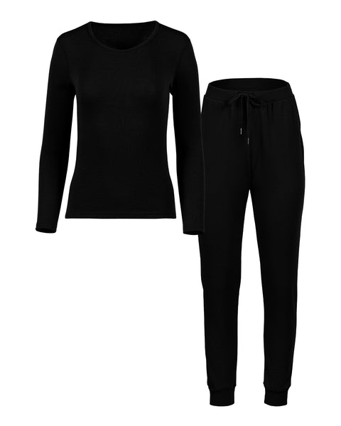 Packshot of women's long sleeve and joggers set in the color black