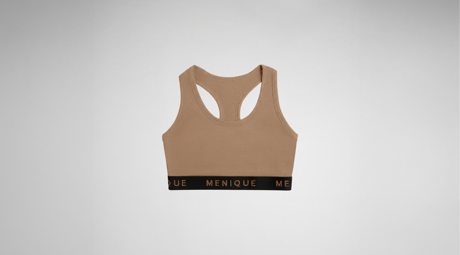 A beige racerback sports bra featuring a thick black underbust band with the brand name "MENIQUE" written in copper-colored text, centered against a light grey background.