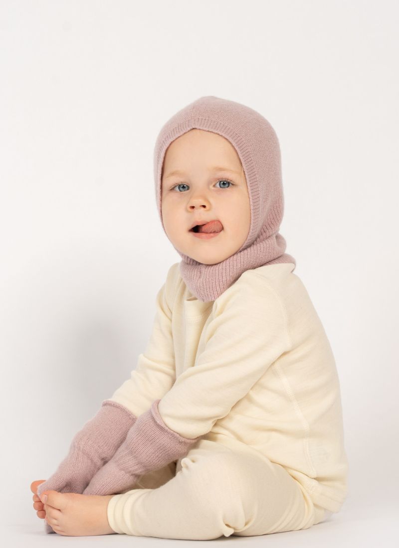 Baby wearing merino wool balaclava and mittens in pink, warm and gentle winter accessories