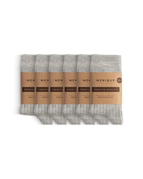 Six pairs of light gray thin ribbed kids’ socks, folded neatly and wrapped in Menique branded paper bands labeled ‘Premium Quality.
