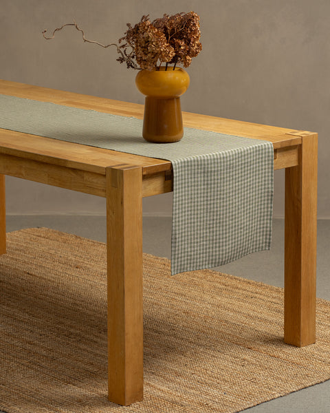 The menique green check linen table runner. 