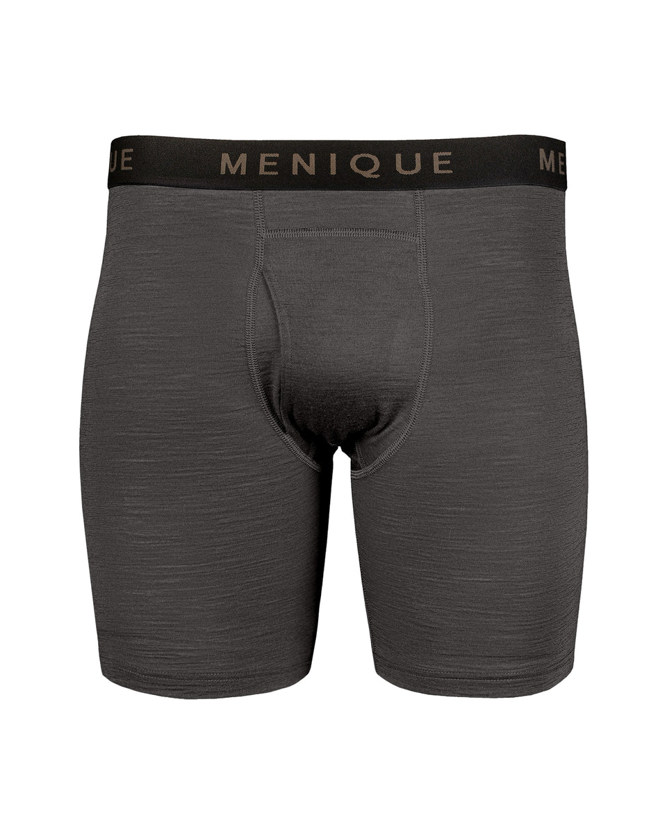 A flat lay product shot of charcoal grey men's long boxer briefs featuring a black elastic waistband with the word "MENIQUE" repeated in brown lettering, against a white background.