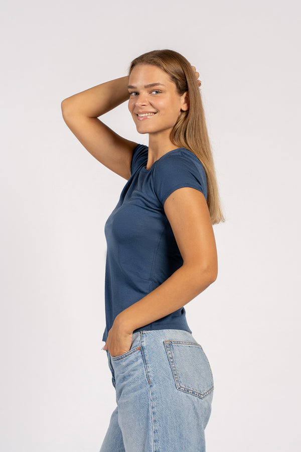 Side view of model wearing denim Merino T-shirt – soft lightweight wool tee