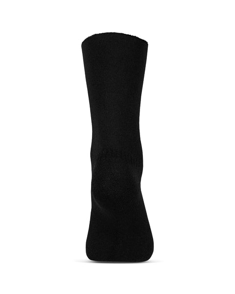 The menique women's merino lined sherpa socks in color black, in a white background, heel  view.