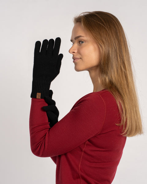 Classic black cashmere short gloves for women, crafted from premium knit. Warm, lightweight, and breathable gloves offering timeless style for cold seasons.