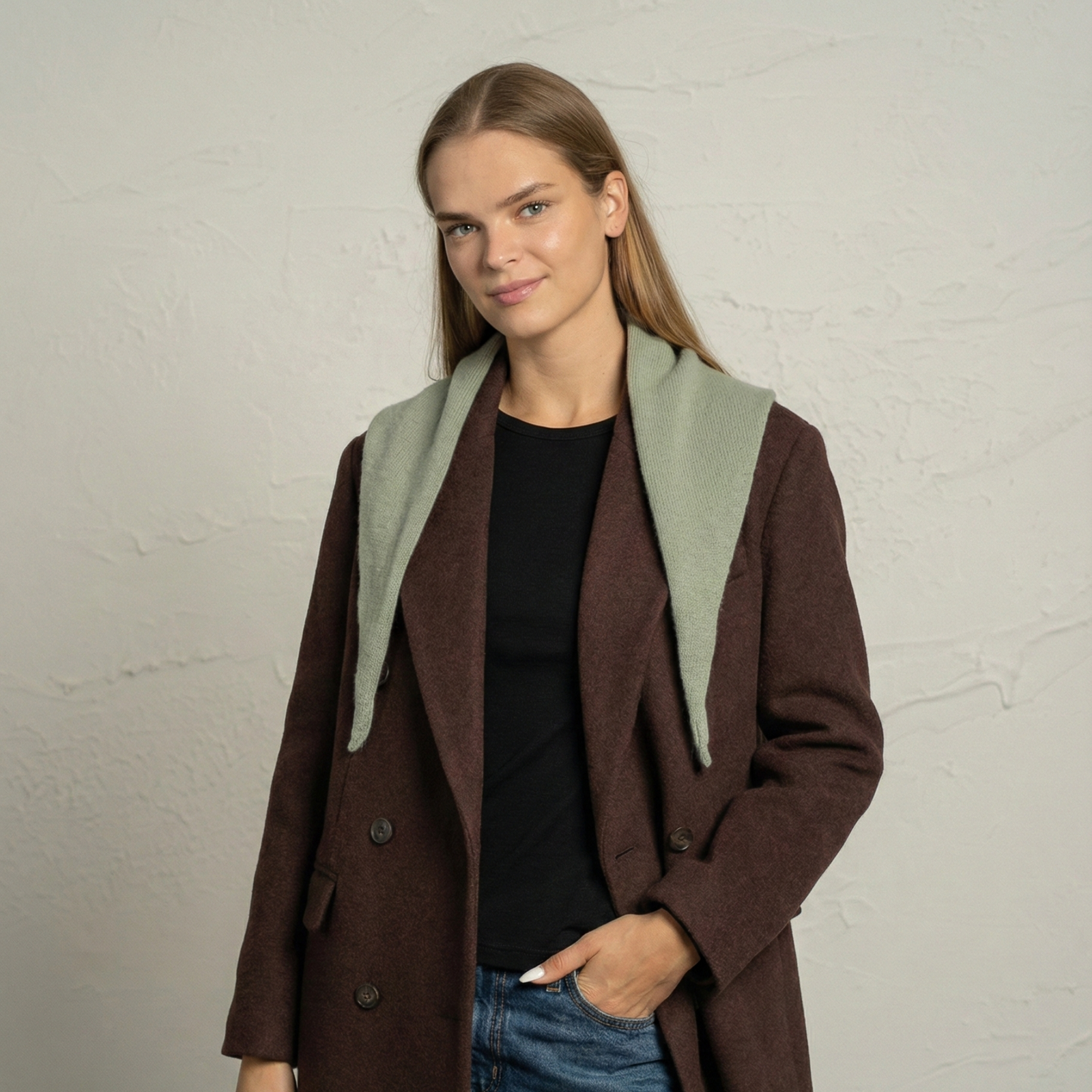 Woman wearing light green cashmere Merino wool bandana tied as neck scarf.