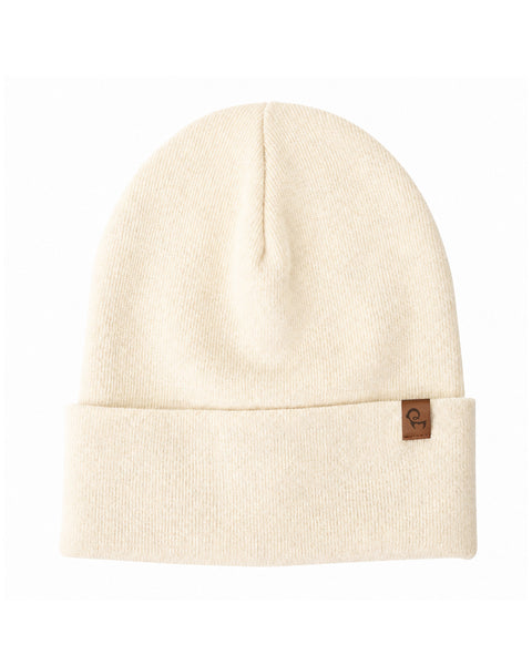 A cream-colored ribbed knit beanie hat with a folded brim and a small brown square logo tag on the right edge.